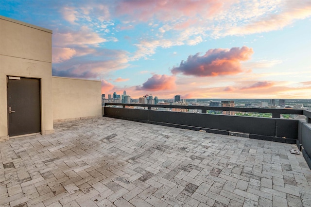 3111 Welborn St Unit 1703, Dallas, TX 75219 - patio terrace at dusk with a view of city and a balcony