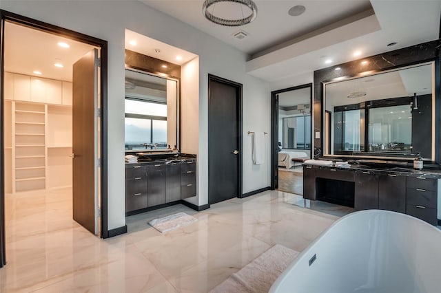 3111 Welborn St Unit 1703, Dallas, TX 75219 - full bathroom with vanity, a soaking tub, recessed lighting, and marble finish floor