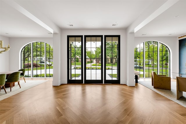 doorway to outside featuring visible vents