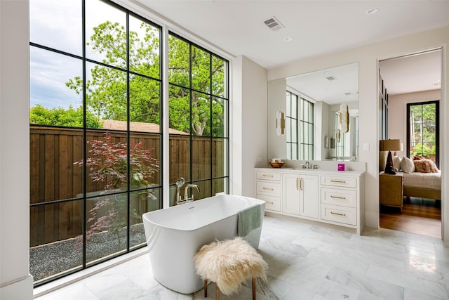 doorway featuring a sink, visible vents, and marble finish floor
