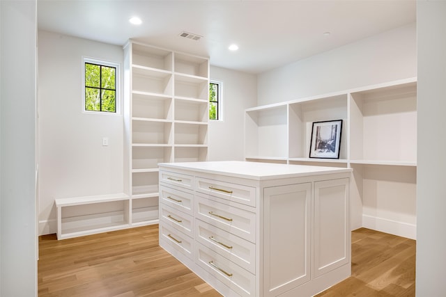 walk in closet with visible vents and light wood-type flooring