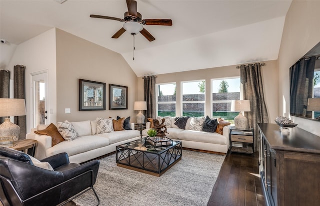 living area with ceiling fan, vaulted ceiling, and dark wood finished floors