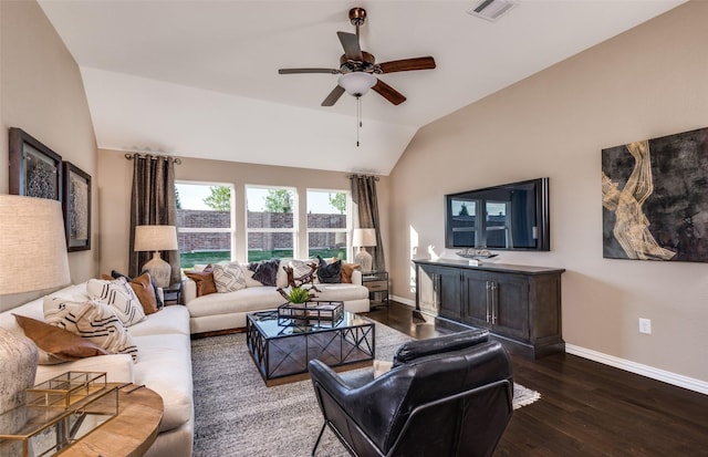living area featuring visible vents, lofted ceiling, baseboards, dark wood-type flooring, and a ceiling fan