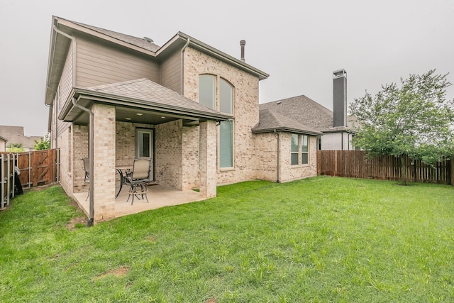 6256 Whitebrush Pl, Fort Worth, TX 76123 - back of property featuring roof with shingles, a patio area, brick siding, a fenced backyard, and a yard