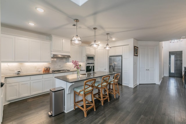 6256 Whitebrush Pl, Fort Worth, TX 76123 - kitchen with white cabinets, dark countertops, appliances with stainless steel finishes, recessed lighting, and backsplash