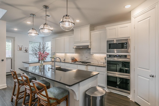 6256 Whitebrush Pl, Fort Worth, TX 76123 - kitchen with a healthy amount of sunlight, appliances with stainless steel finishes, dark countertops, a sink, and recessed lighting