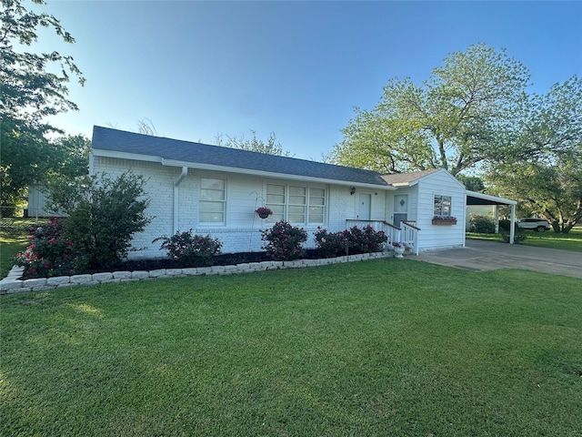1346 Hillcrest Dr, Graham, TX 76450 - ranch-style house with a carport, driveway, brick siding, and a front yard