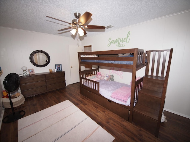 1346 Hillcrest Dr, Graham, TX 76450 - bedroom featuring a ceiling fan, a textured ceiling, visible vents, crown molding, and hardwood / wood-style floors