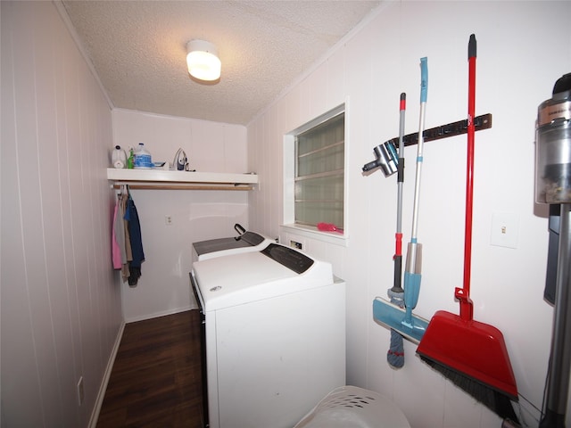 1346 Hillcrest Dr, Graham, TX 76450 - clothes washing area with washer and dryer, crown molding, laundry area, dark wood-style flooring, and a textured ceiling