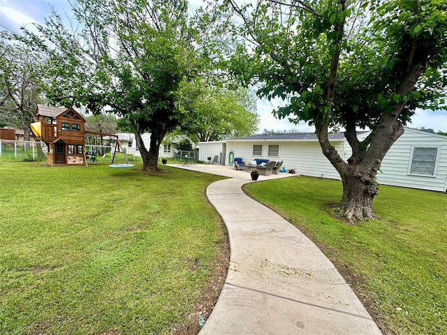 1346 Hillcrest Dr, Graham, TX 76450 - view of yard featuring a patio area, a playground, and fence