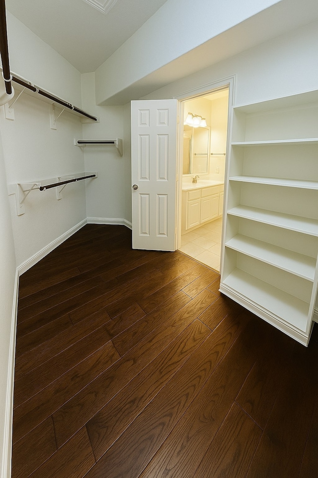 4605 Stargazer Dr, Plano, TX 75024 - spacious closet with dark wood finished floors and a sink