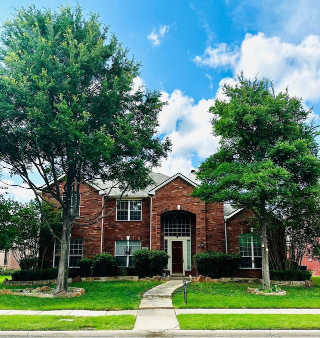 4605 Stargazer Dr, Plano, TX 75024 - traditional home with a front yard and brick siding