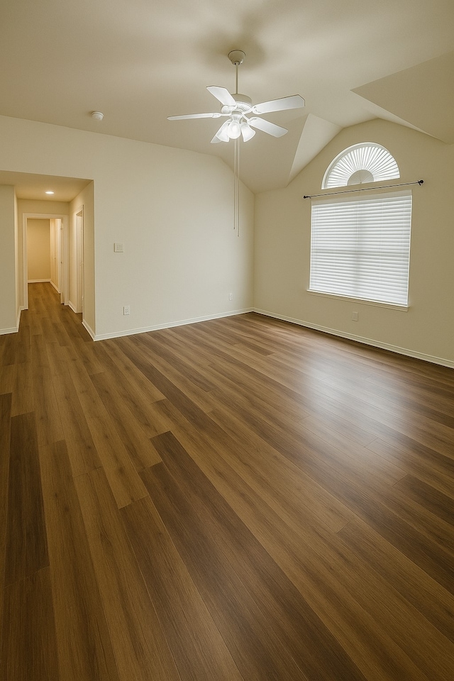 4605 Stargazer Dr, Plano, TX 75024 - spare room featuring baseboards, ceiling fan, vaulted ceiling, and dark wood-style floors
