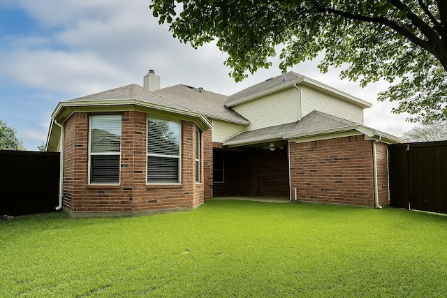 4605 Stargazer Dr, Plano, TX 75024 - exterior space featuring a yard, brick siding, fence, and a chimney
