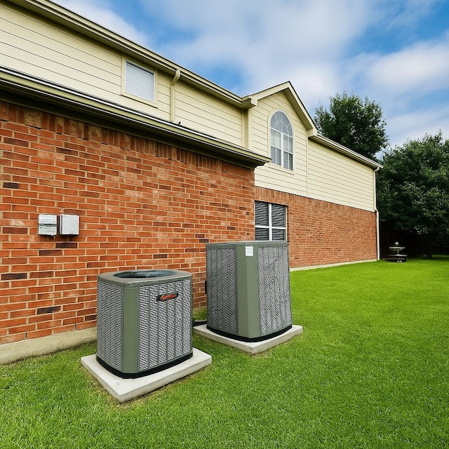 4605 Stargazer Dr, Plano, TX 75024 - exterior space with a lawn, central AC, and brick siding