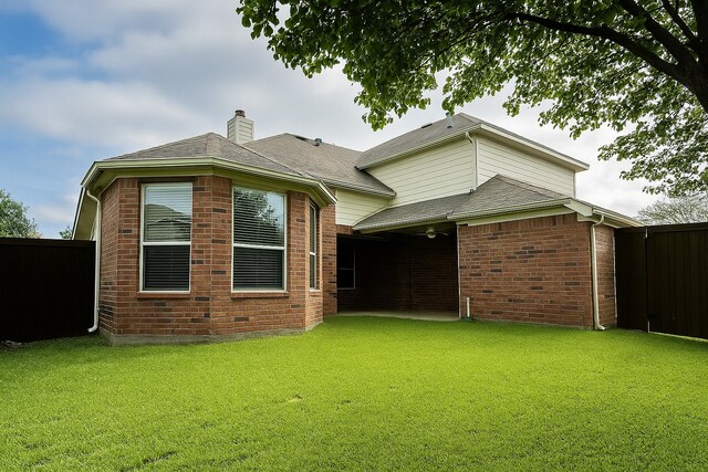 4605 Stargazer Dr, Plano, TX 75024 - back of property with a chimney, brick siding, and a shingled roof