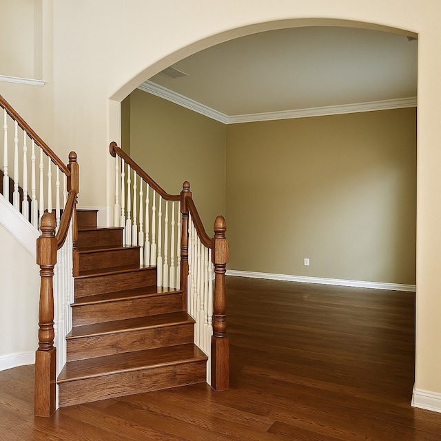 4605 Stargazer Dr, Plano, TX 75024 - staircase featuring crown molding, baseboards, arched walkways, and wood finished floors