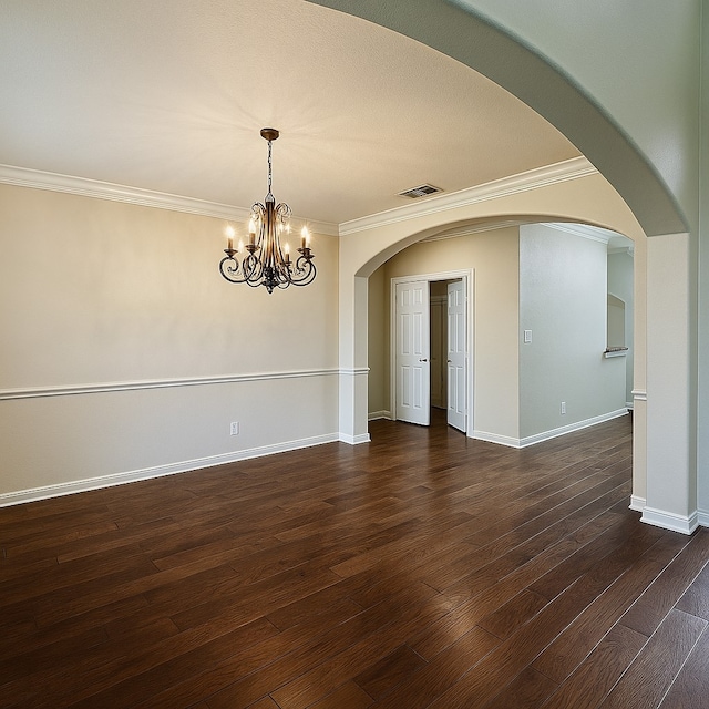 4605 Stargazer Dr, Plano, TX 75024 - empty room featuring crown molding, arched walkways, a chandelier, dark wood-type flooring, and visible vents