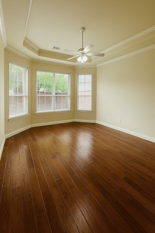4605 Stargazer Dr, Plano, TX 75024 - empty room featuring ceiling fan, visible vents, baseboards, dark wood-style floors, and ornamental molding