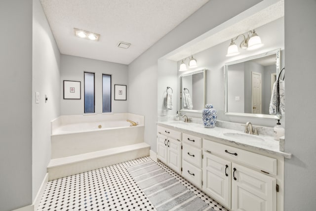 bathroom with a sink, baseboards, and a garden tub
