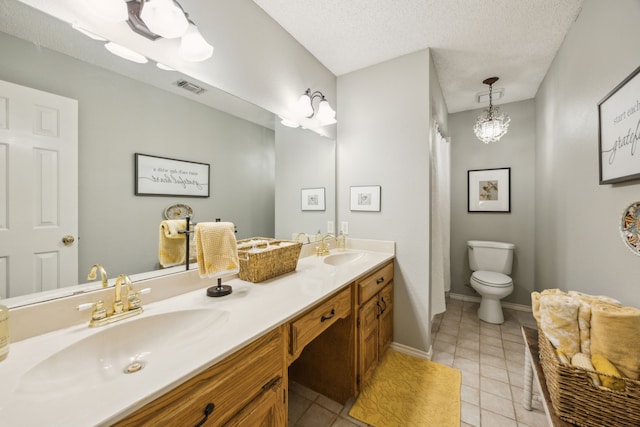 full bath with visible vents, a sink, and tile patterned flooring