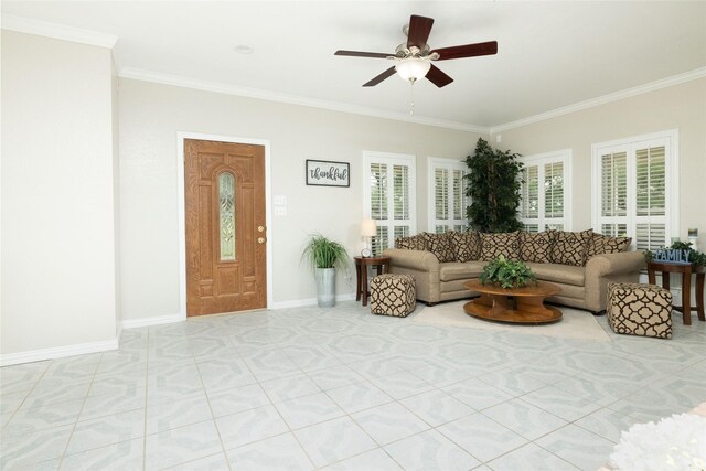 living room with baseboards, a ceiling fan, and ornamental molding