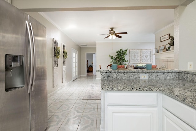3130 Cimmaron Rd, Weatherford, TX 76087 - kitchen with stainless steel refrigerator with ice dispenser, crown molding, a ceiling fan, white cabinets, and light stone countertops