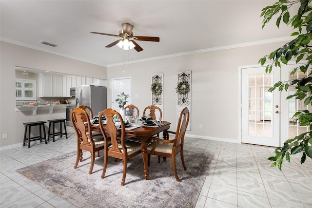 dining area with visible vents, a ceiling fan, light tile patterned flooring, and ornamental molding