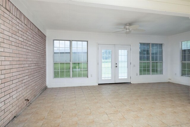 unfurnished sunroom featuring french doors and a healthy amount of sunlight