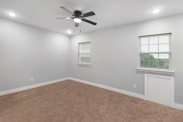 empty room with baseboards, ceiling fan, carpet flooring, and recessed lighting