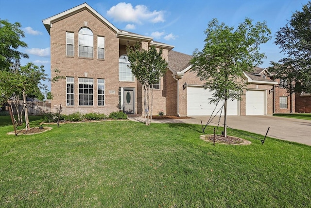 view of front facade with an attached garage, concrete driveway, a front lawn, and brick siding