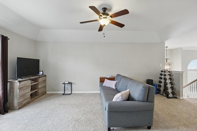 living room with baseboards, ceiling fan, and carpet flooring