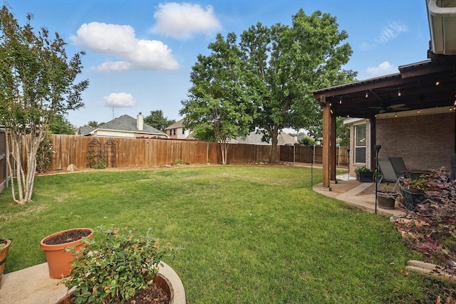 view of yard with a fenced backyard and a patio area