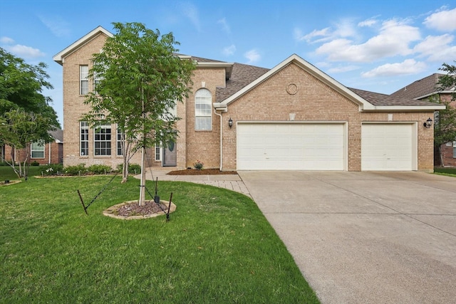 traditional-style home featuring an attached garage, driveway, brick siding, and a front yard