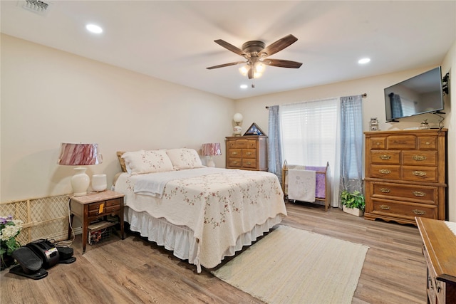 bedroom with recessed lighting, ceiling fan, visible vents, and light wood-style flooring