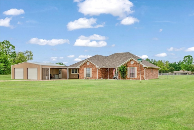 ranch-style house with a garage, fence, brick siding, and a front yard