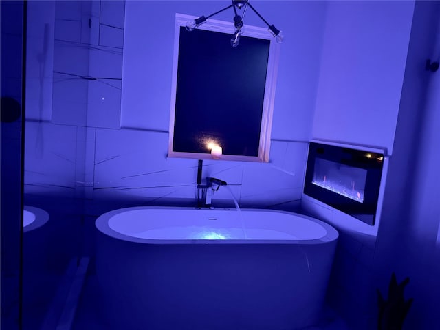 433 Fieldwood Dr, Richardson, TX 75081 - full bath with a freestanding tub and tile walls