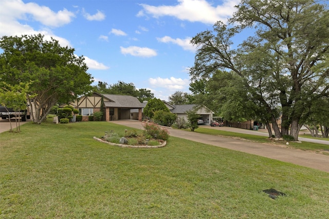 view of front of property with a carport, driveway, and a front yard