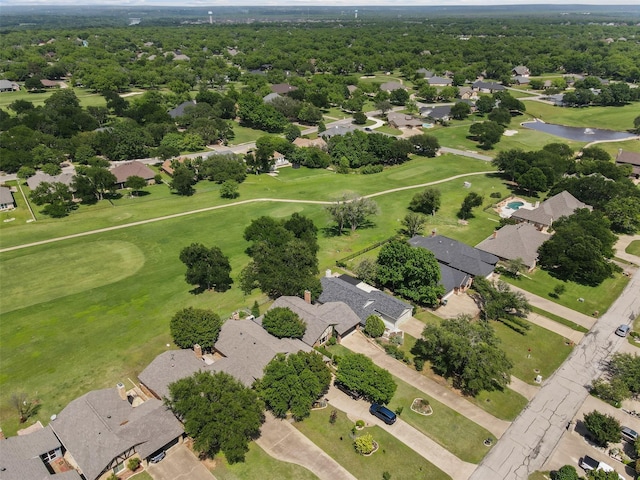 birds eye view of property featuring a residential view, view of golf course, and a water view