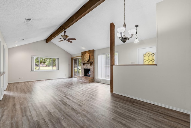 unfurnished living room featuring wood finished floors, a fireplace, baseboards, vaulted ceiling with beams, and ceiling fan with notable chandelier