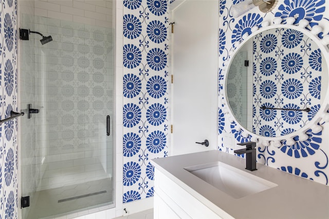 full bath with vanity and a stall shower