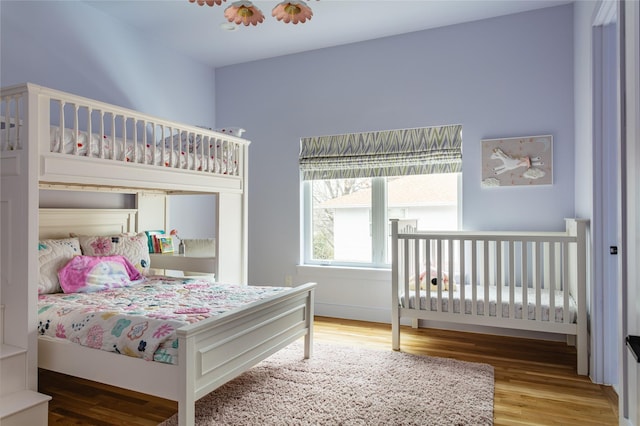 bedroom featuring wood finished floors