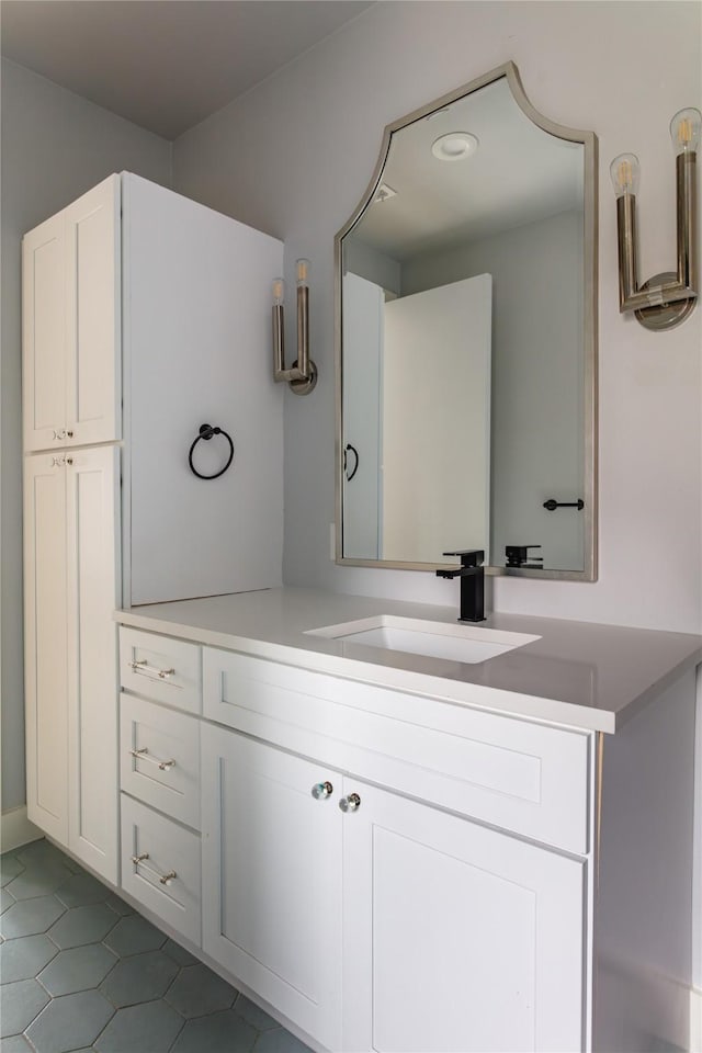bathroom featuring tile patterned floors and vanity