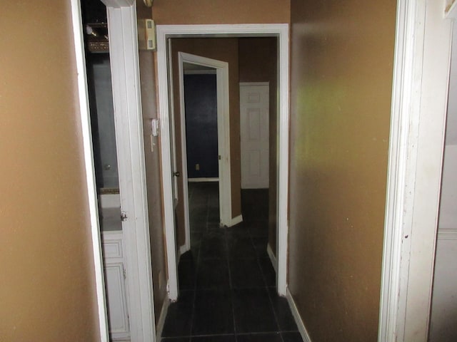 4231 Scenic Dr, Shreveport, LA 71119 - hall with dark tile patterned flooring and baseboards