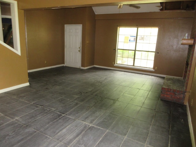 4231 Scenic Dr, Shreveport, LA 71119 - unfurnished room featuring baseboards and dark tile patterned floors