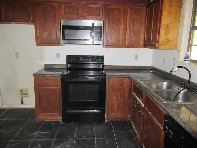 4231 Scenic Dr, Shreveport, LA 71119 - kitchen featuring a sink, black appliances, dark countertops, and dark tile patterned flooring
