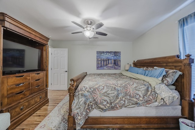 bedroom with light wood-style floors and ceiling fan
