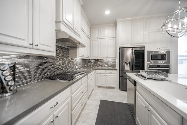 7005 Homestead Dr, Mckinney, TX 75070 - kitchen featuring backsplash, a chandelier, appliances with stainless steel finishes, and white cabinetry