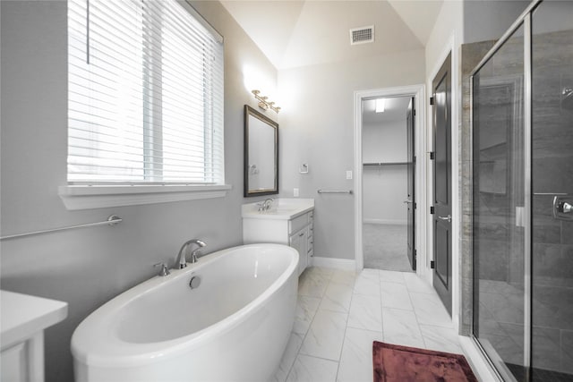 7005 Homestead Dr, Mckinney, TX 75070 - bathroom featuring visible vents, vanity, marble finish floor, a freestanding bath, and a stall shower
