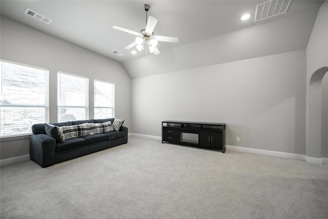7005 Homestead Dr, Mckinney, TX 75070 - carpeted living area featuring baseboards, lofted ceiling, and visible vents